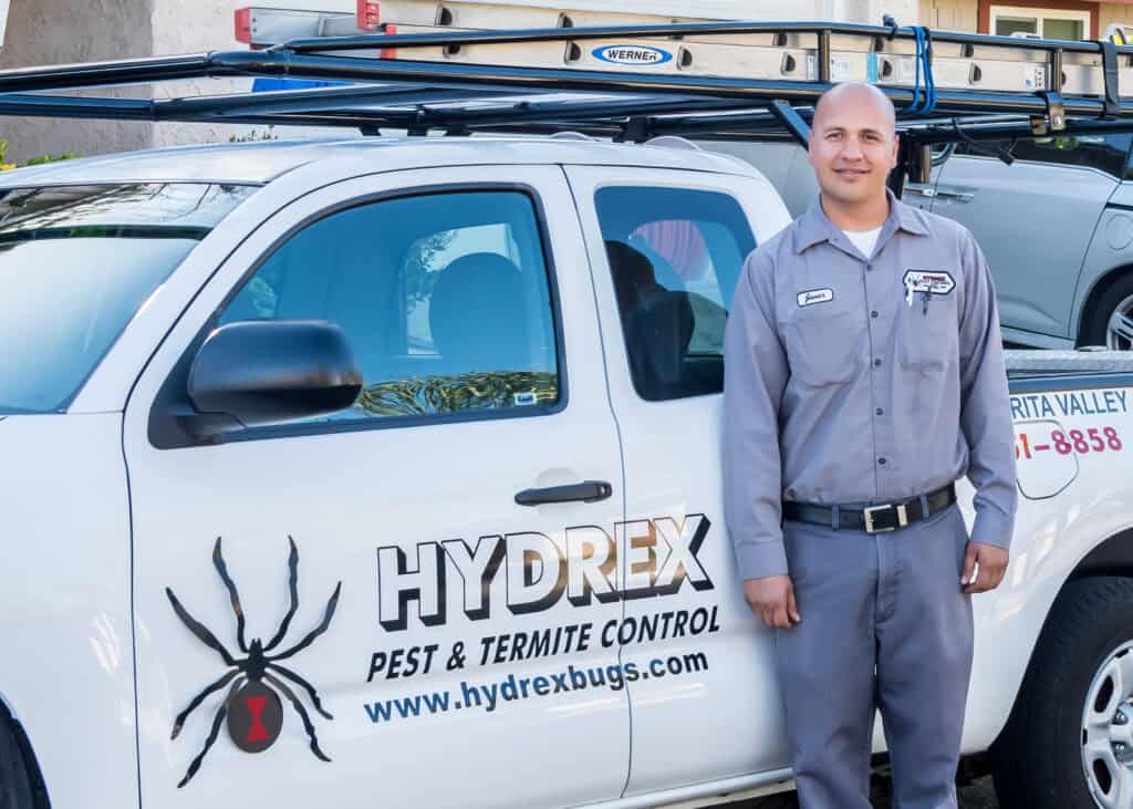 Technician applying pest treatment in Santa Clarita